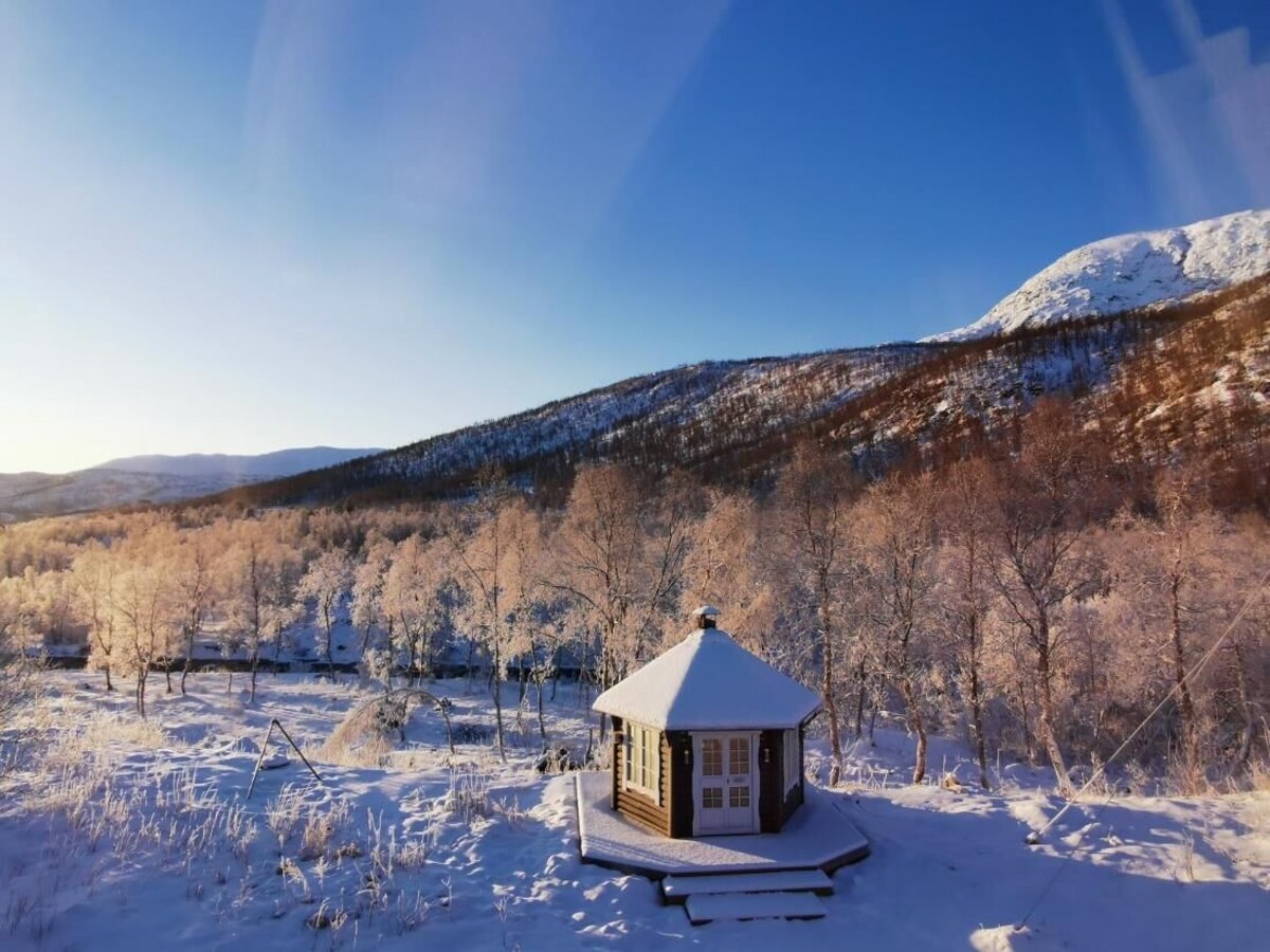 Elvestua in a snowy landscape on Senja